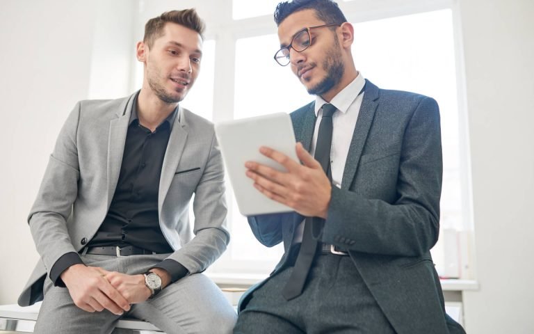 two-entrepreneurs-using-digital-tablet-2021-09-24-03-56-22-utc.jpg